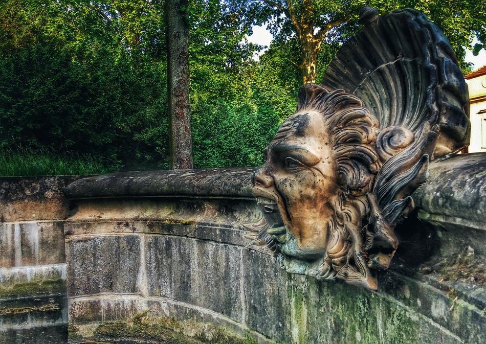 an old sculpture of an abandoned fountain