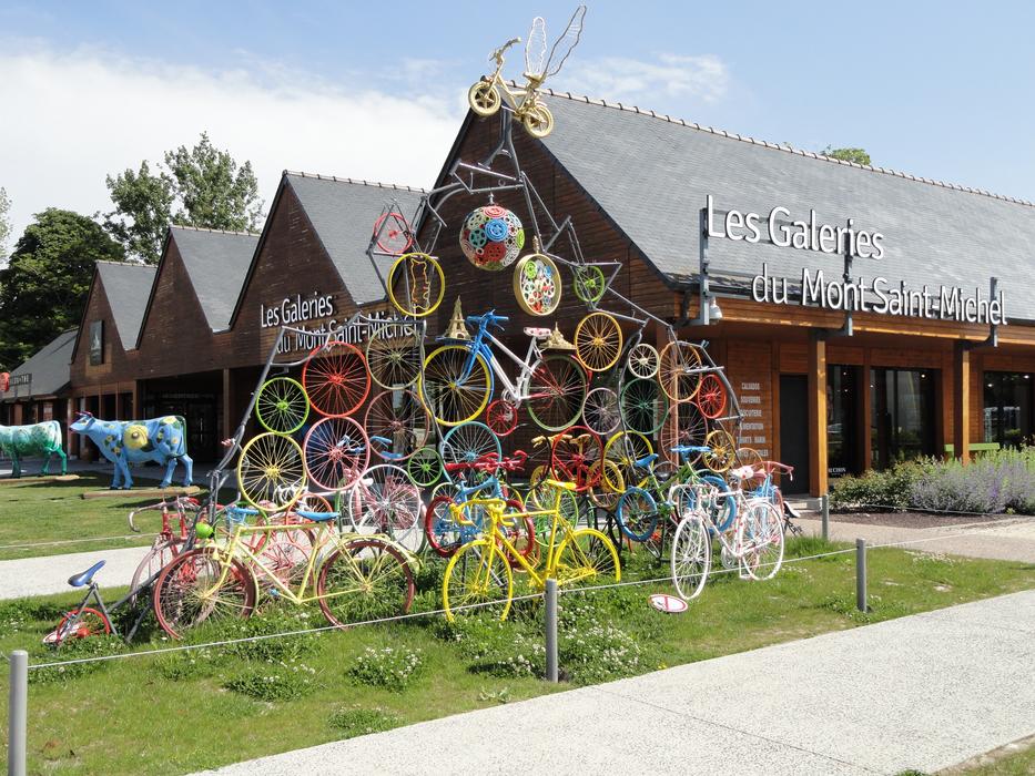 figure made of iron colored bicycles