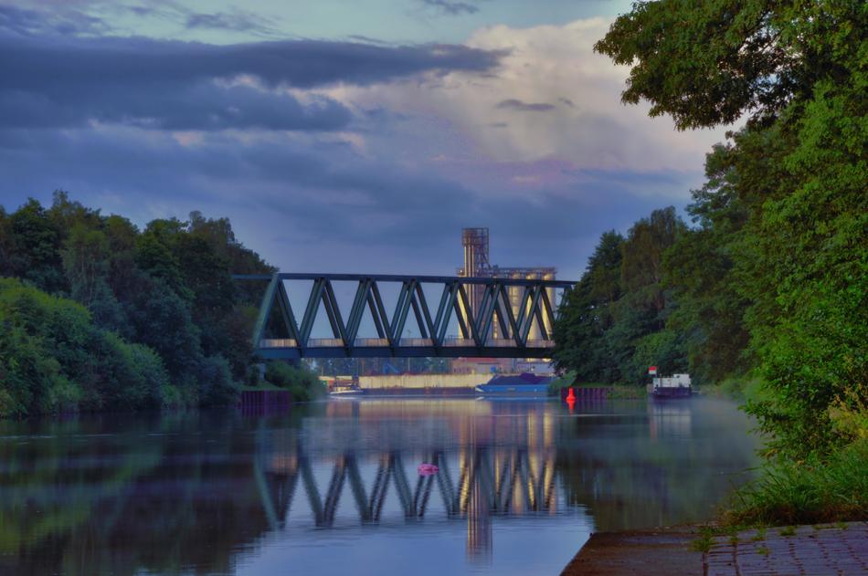 Beautiful landscape of the Mittelland Canal with the bridge, among the plants, in Germany