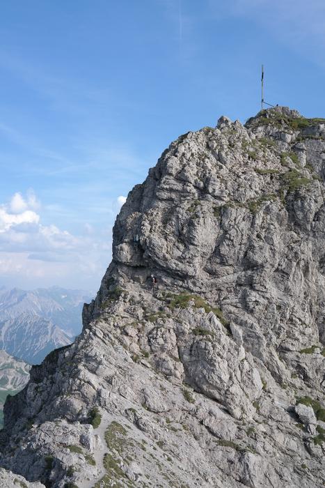 high mountain with the sky in the background