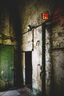 exit sign on wall in Abandoned Building