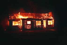 burning residential building at night
