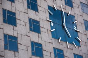 Clock on Wall Building in city