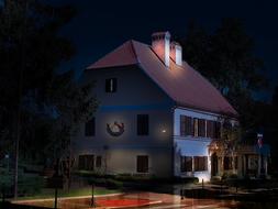 photo of illuminated cottage at night