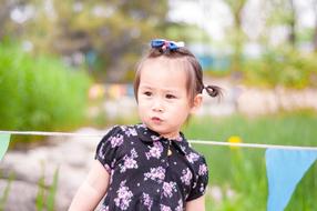 little girl on the background of nature