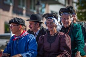 parade of people in beautiful costumes
