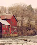 Beautiful house near the river among colorful nature