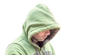 Cold Man in green hood at white background
