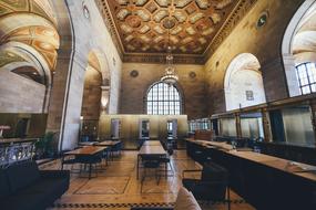 long tables with chairs in historical interior