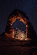 arch in the light against a starry sky