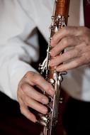 man plays Clarinet