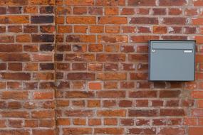 mailbox on a brick wall