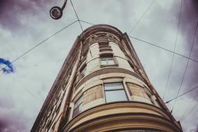 photo of the facade of the old building and electric wires