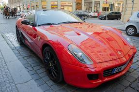 red luxury sports car in old city, czech, Prague