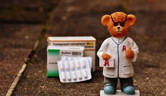 figure of doctor bear next to the medicine