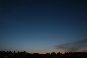 moon in the sky at dawn