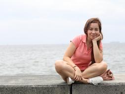 Woman Sitting Pier