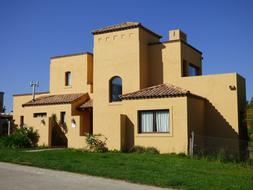 big yellow House Facade at blue sky background