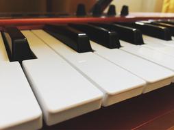 black and white piano keyboard in closeup