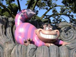 smiling funny cat sculpture in garden