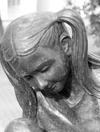 bronze head of a statue of a girl in Hungary