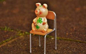 toy pig on a chair