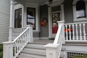 porch with wooden railing at house