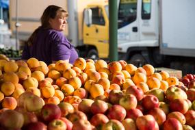 woman with apples in background