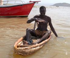 man sits with fish