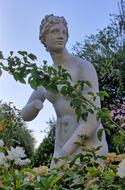 female Statue behind rose shrubs, usa, nevada, Las Vegas