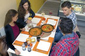 people chatting nicely at the table with food