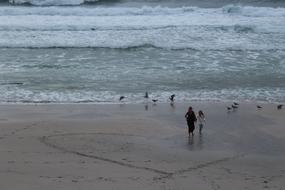 Mother and daughter on Beach aerial view