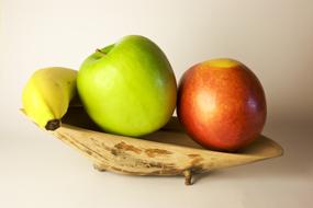 Apple Fruits on wooden plate