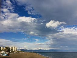 clouds in the blue sky over the sea water