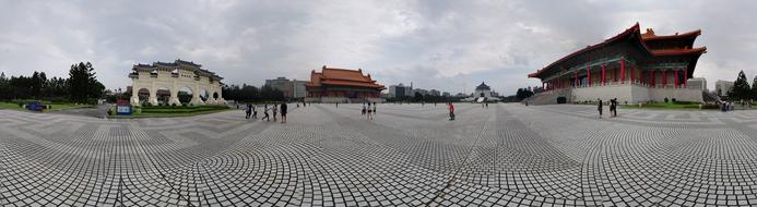 People, near the beautiful and colorful monument in Taipei, Taiwan, under the cloudy sky