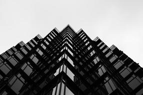 tall dark building with windows, bottom view