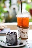 cold drink and dessert on table