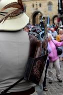 a man with a vintage gun in a holster