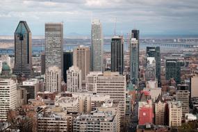 panoramic view of modern cityscape on cloudy day