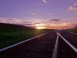 sunset against a background of rails