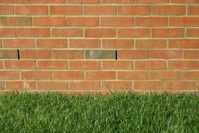 Brick architecture near green grass