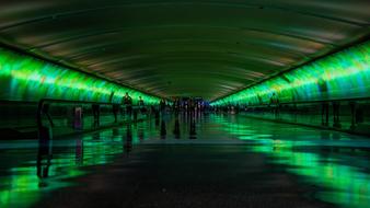 People, walking in the tunnel with the colorful lights and reflections, clipart