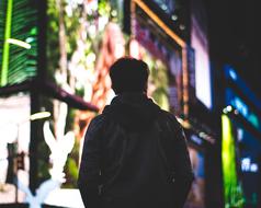 person at the background of illuminated Buildings