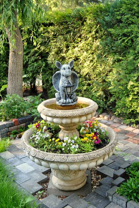 sculpture on the fountain in the garden