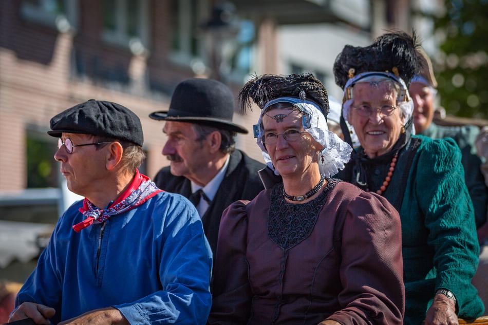 parade of people in beautiful costumes
