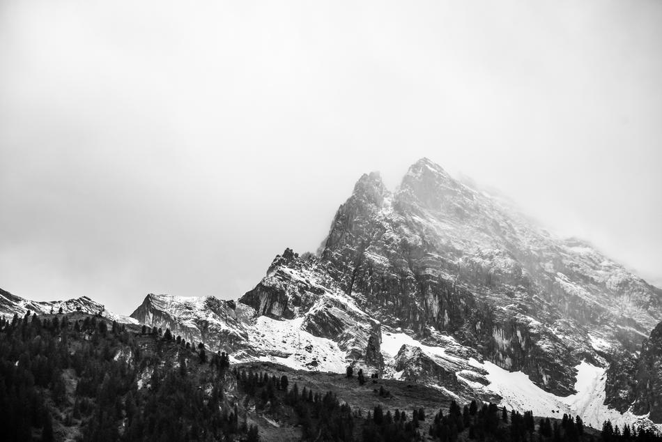 black and white, dense fog on the top of the mountain
