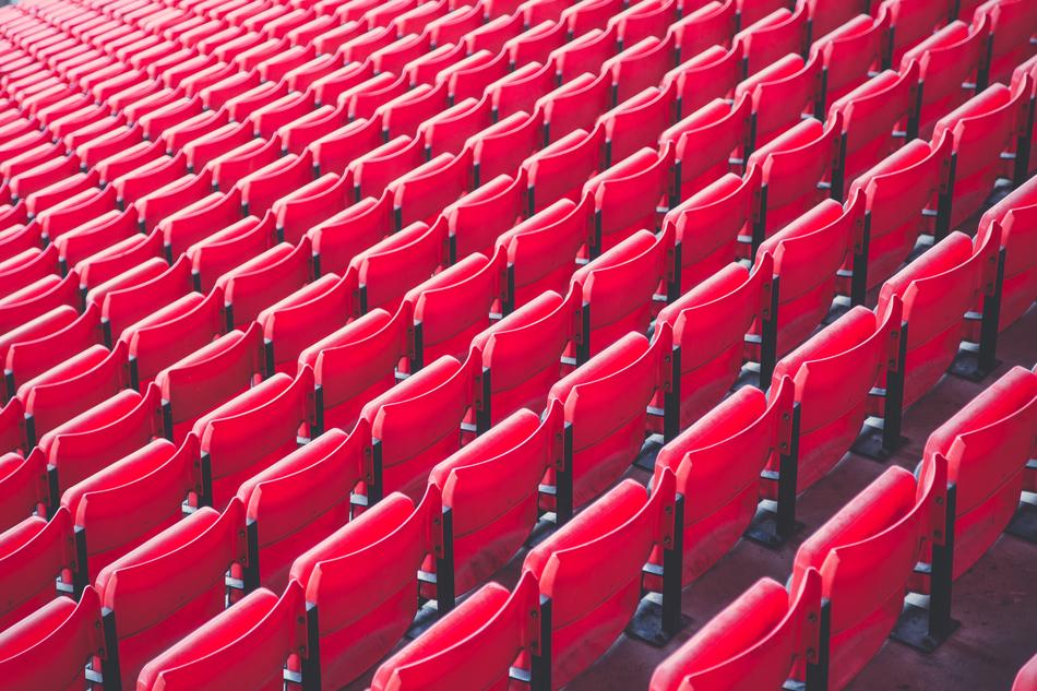Bleachers with red seats in light