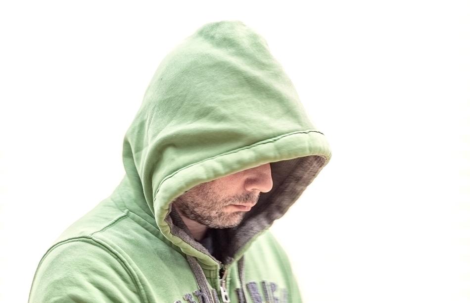 Cold Man in green hood at white background