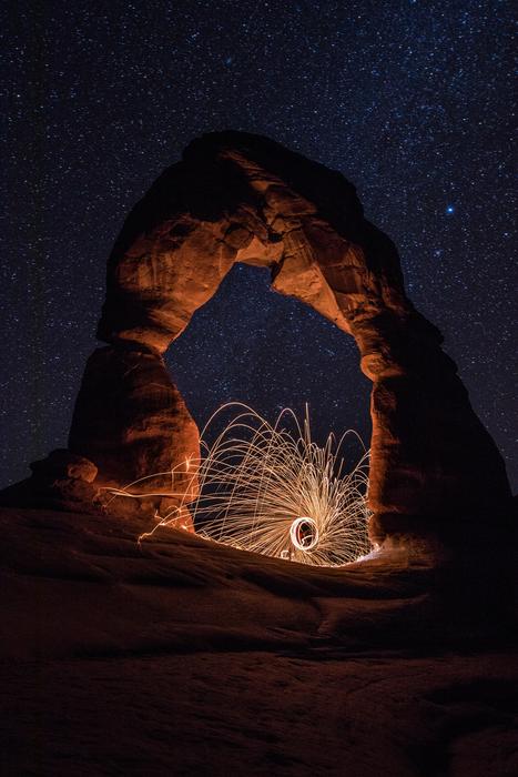 arch in the light against a starry sky