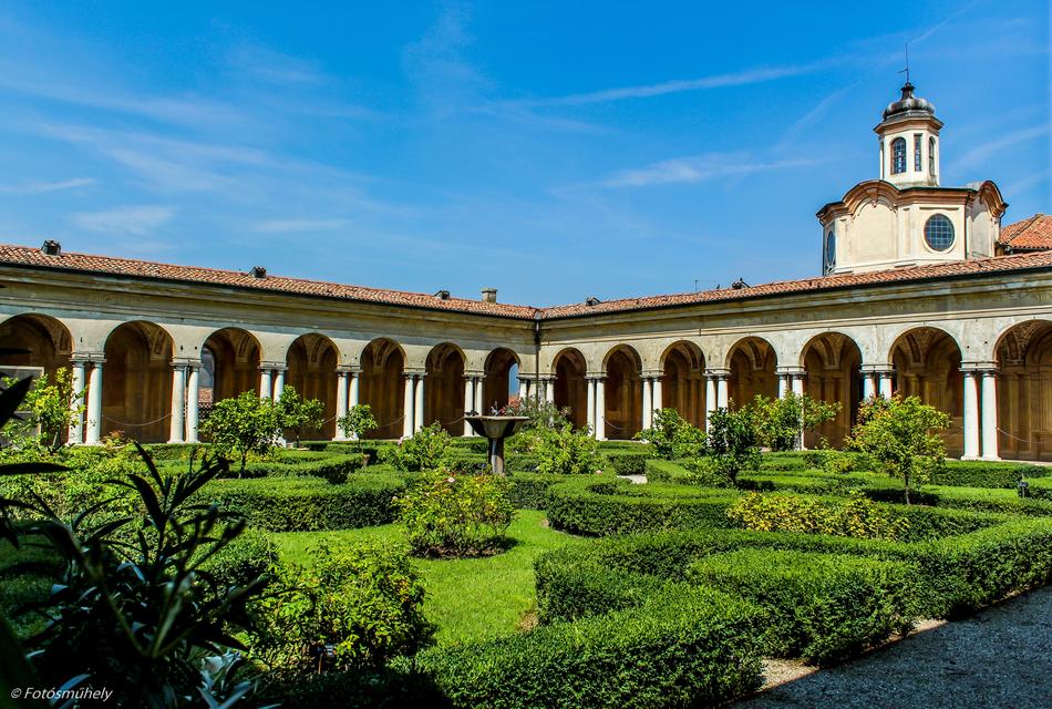 an old manor house with a garden